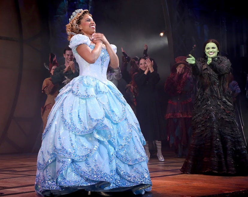 Brittney Johnson as Galinda in a light blue gown