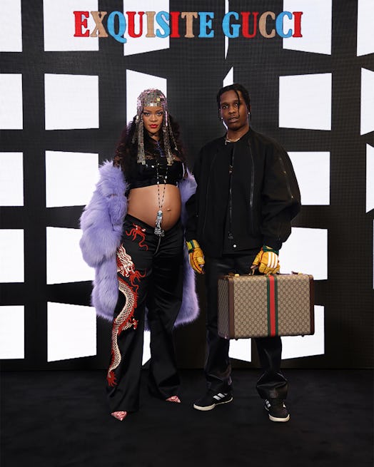 A$AP Rocky and Rihanna in her maternity outfit at the Gucci show. 