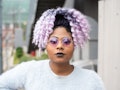 A woman uses purple hair quotes as captions for new hair color.