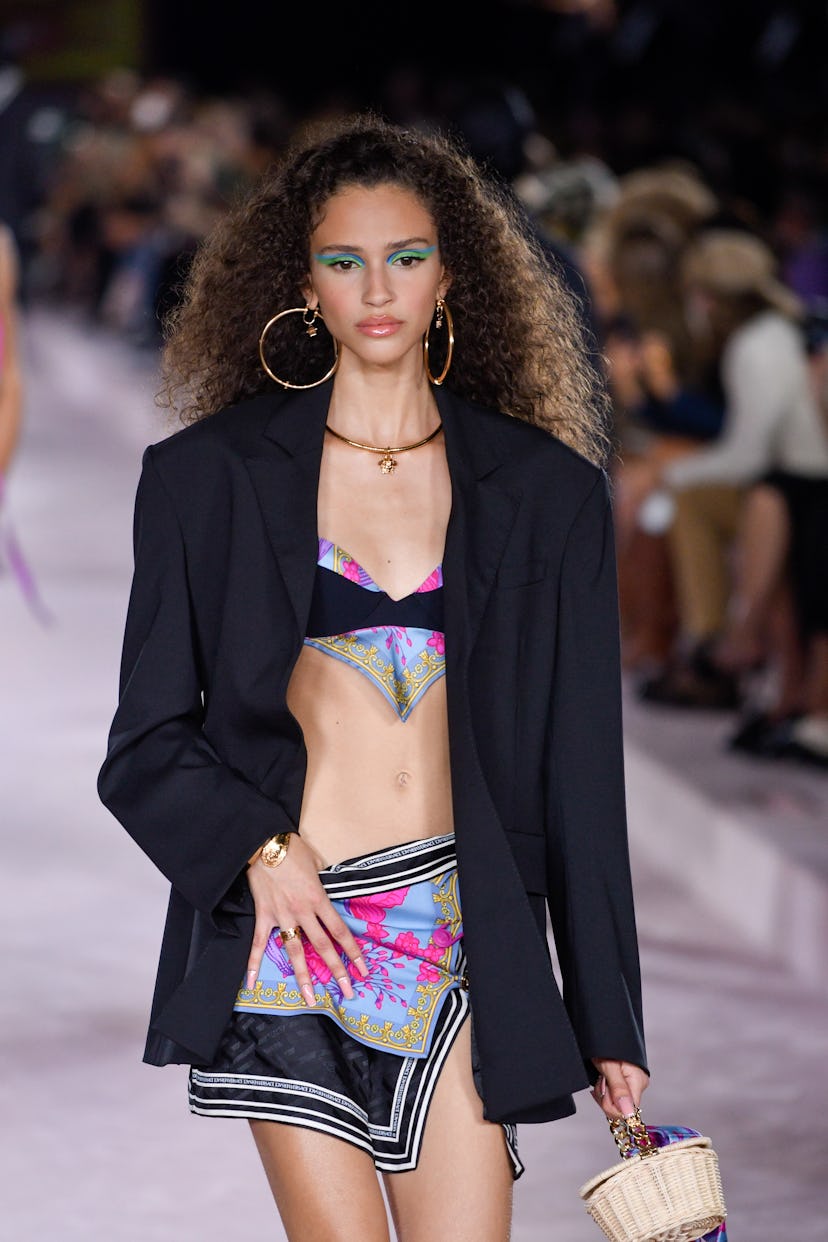 Here are 8 spring 2022 makeup trends to try for your next beauty look. Here, neon eyeshadow at Versa...