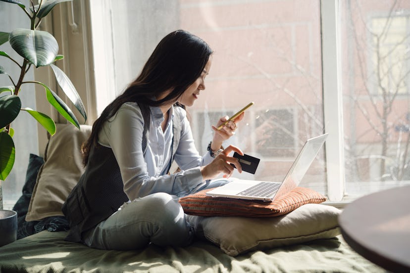 a woman on her phone in a list of April Fools' pranks to play on your wife 