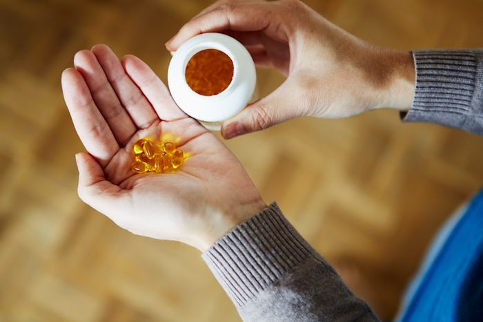 woman taking vitamins
