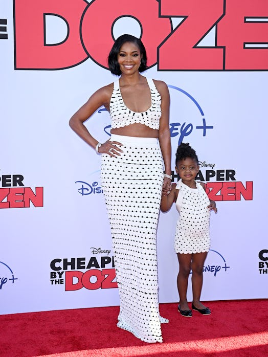 Gabrielle Union wearing matching outfits with her daughter at the Cheaper by the Dozen premiere. 