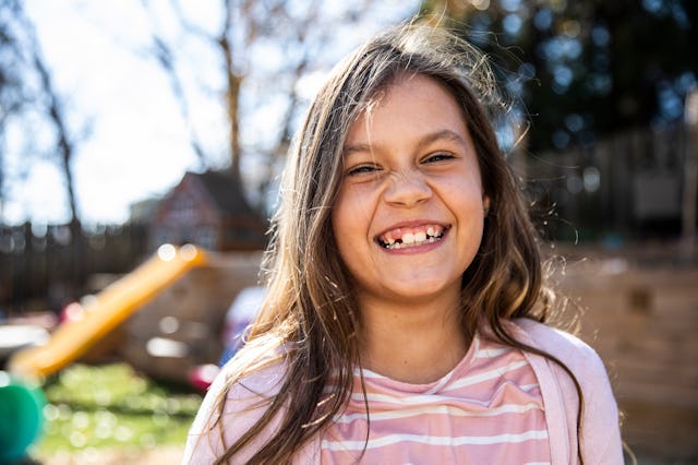 Portrait of young girl in backyard