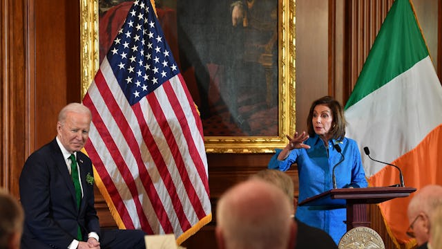 US Speaker of the House Rep. Nancy Pelosi (D-CA) speaks as US President Joe Biden listens during the...