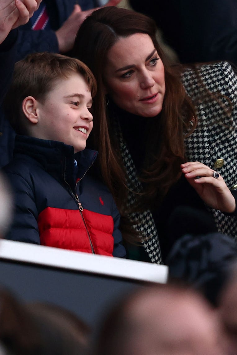 Britain's Prince George of Cambridge (L) talks to his mother Britain's Catherine, Duchess of Cambrid...