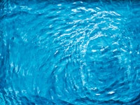 Blue water texture as abstract background, swimming pool and waves designs