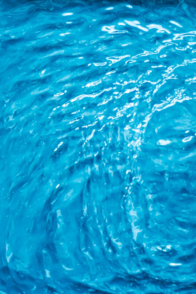Blue water texture as abstract background, swimming pool and waves designs