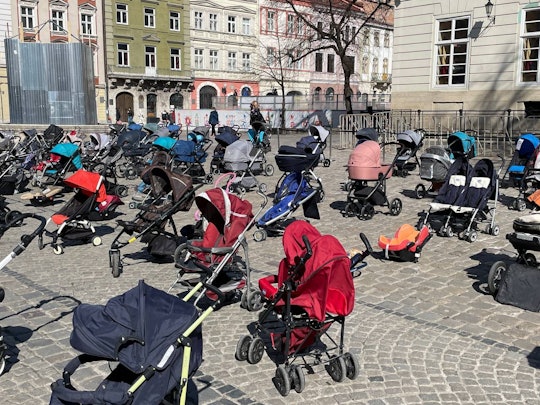 More than 100 empty strollers left to remember babies lost to Russian conflict.