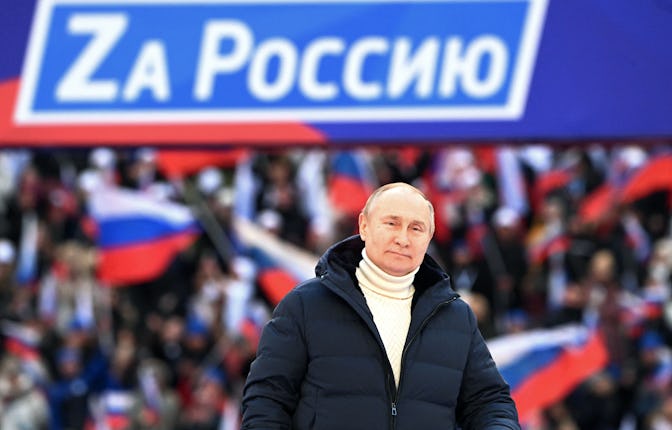 Russian President Vladimir Putin attends a concert marking the eighth anniversary of Russia's annexa...