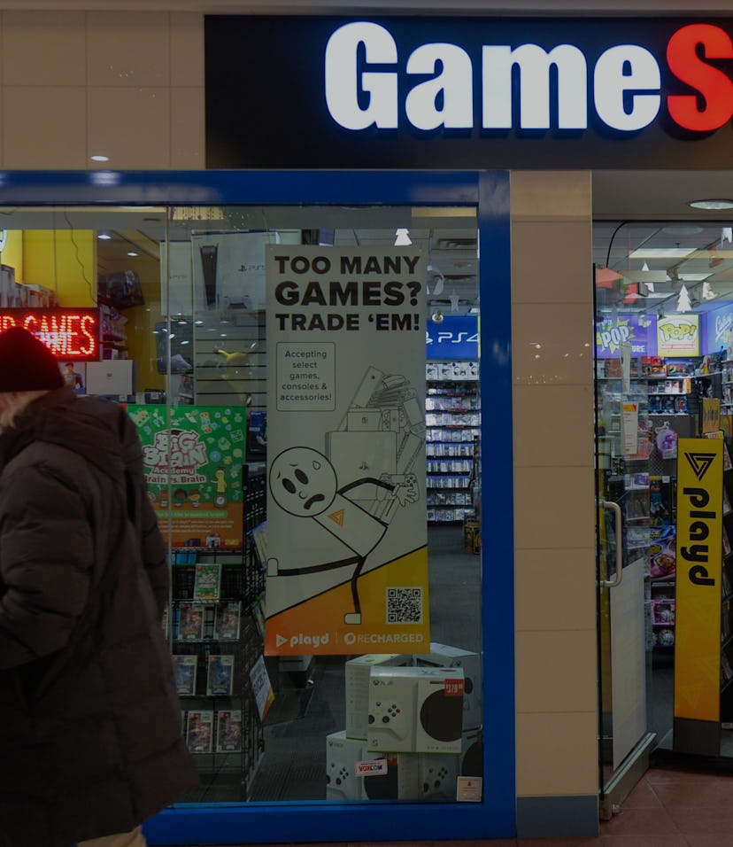 A couple walks past the entrance to the Game Stop store inside a shopping mall in Edmonton.
On Thurs...