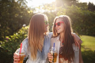 Two girls ignoring mom because they are embarrassed by her