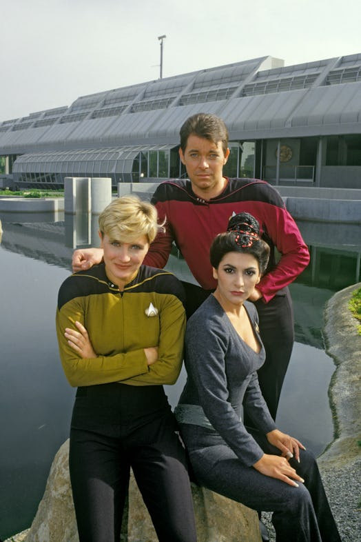 NORTH HOLLYWOOD, CA - 1987: Jonathan Frakes (rear), Denise Crosby (left) and Marina Sirtis, stars of...