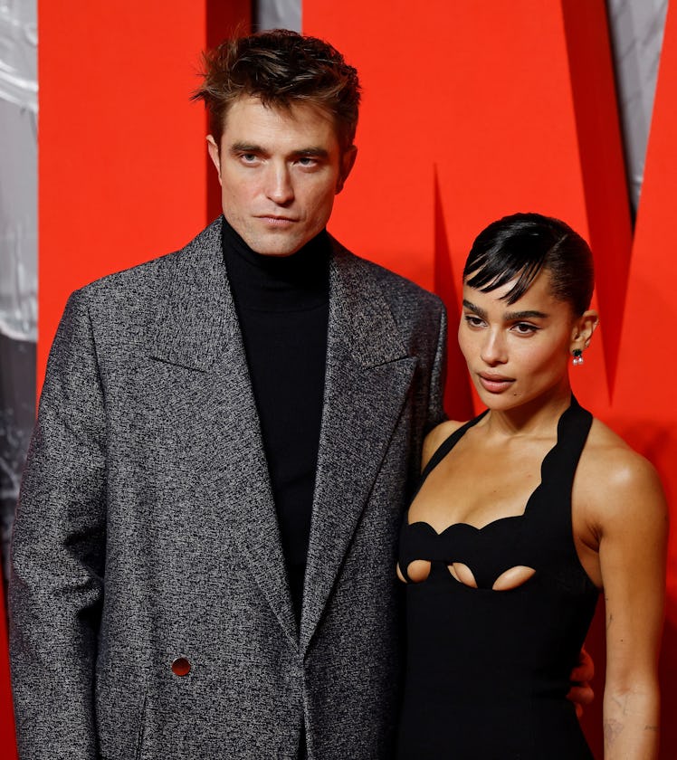 Zoe Kravitz and Robert Pattinson pose on the red carpet upon arrival for a special screening for the...
