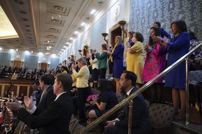 Attendees applaud while listening to U.S. President Joe Biden deliver the State of the Union address...