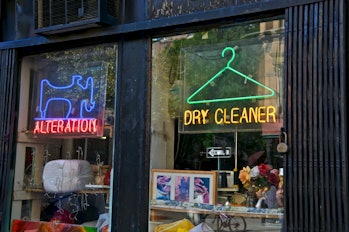 New York City, USA - October 08, 2011: A Dry Cleaning and alteration business storefront window and ...