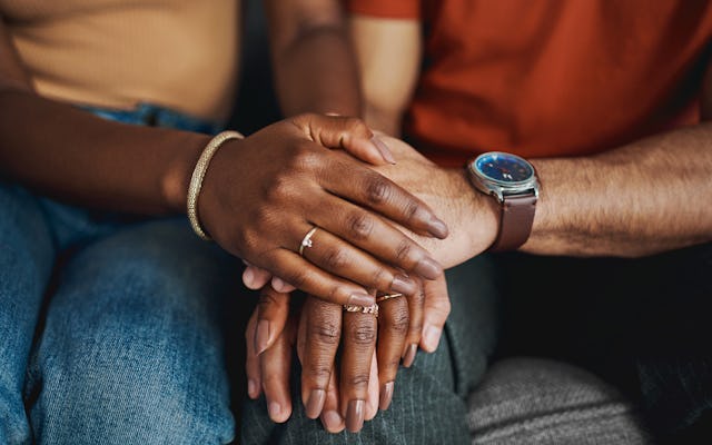 A couple supporting each other in couples therapy