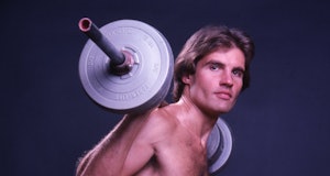 Portrait of fitness model Rick Foster as he lifts a barbell, New York, New York, October 1978. The p...