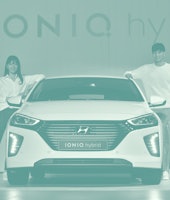 South Korean models pose with Hyundai Motors' new green car model "Ioniq hybrid" during the unveilin...