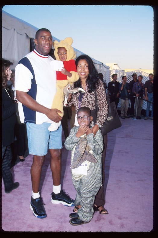 Earvin "Magic" Johnson poses with his wife Cookie, daughter Elisa, and son E.J. October 25, 1997 in ...