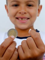 A young boy cashes in on a lost tooth thanks to a visit from the tooth fairy