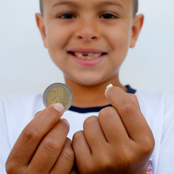 A young boy cashes in on a lost tooth thanks to a visit from the tooth fairy