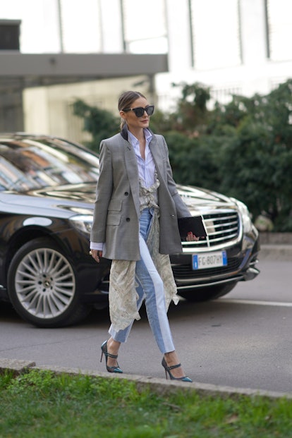 Olivia Palermo street style sheer dress with layered jeans, shirt and blazer.