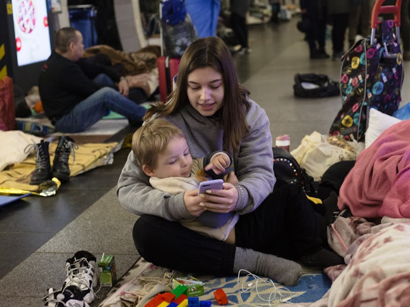 KYIV, UKRAINE - MARCH 02: A family stays in Dorohozhychi metro station which is currently used as a ...