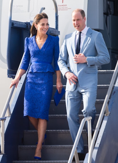 Kate Middleton and Prince William in coordinating blue attire. 
