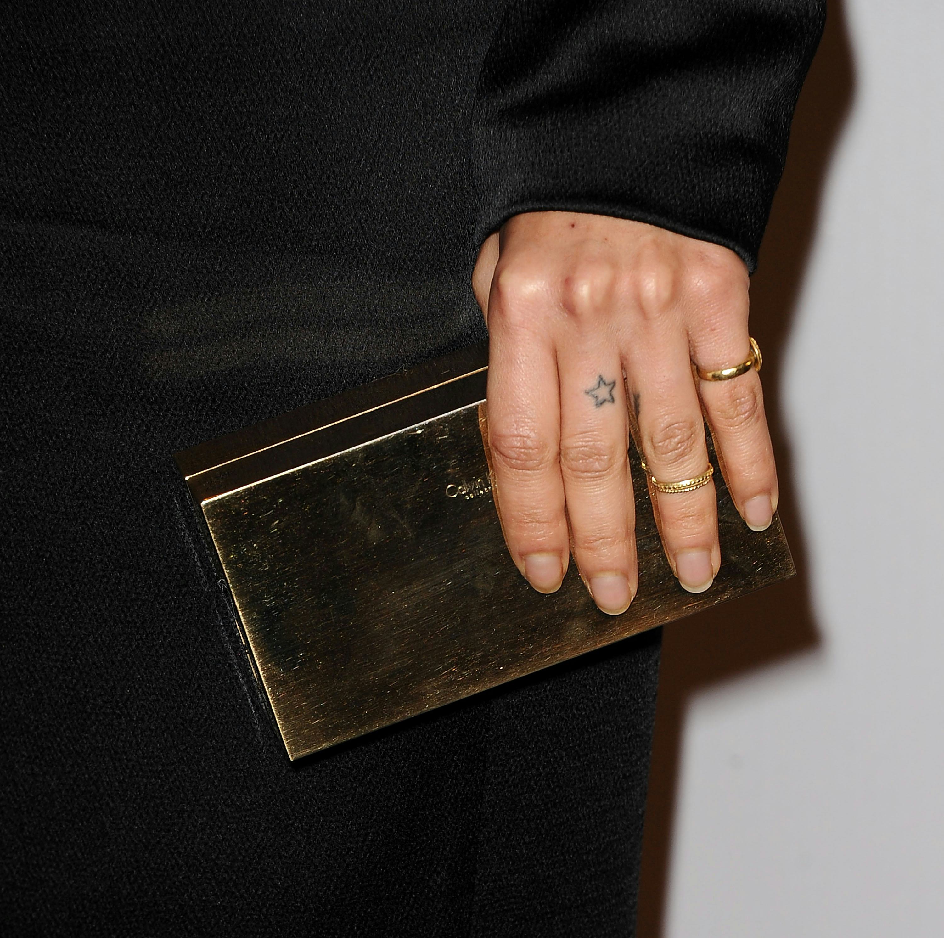 Zoë Kravitz&rsquo;s finger tattoo of a star.