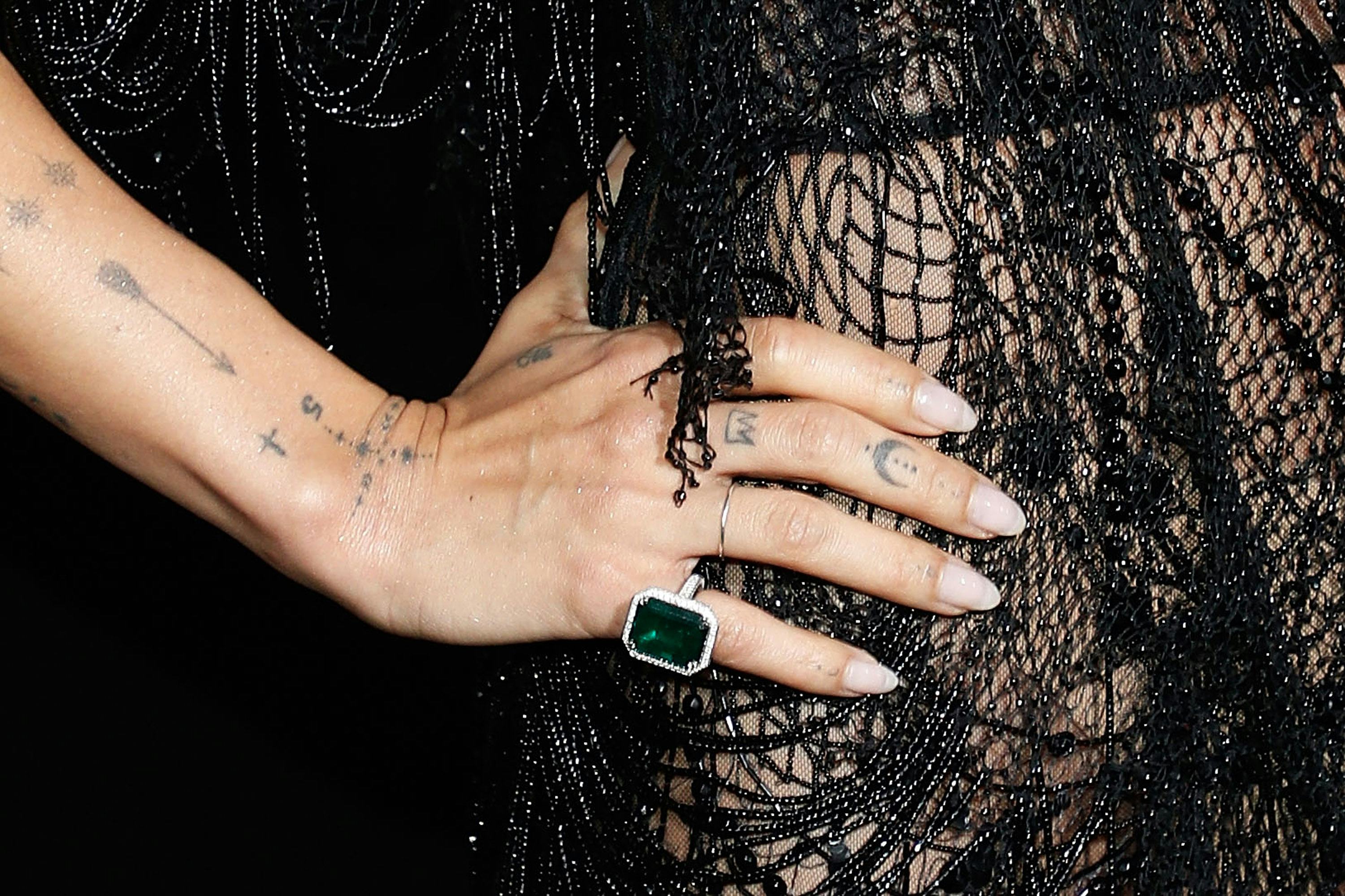 Zoë Kravitz tattoos include a crown on her finger.