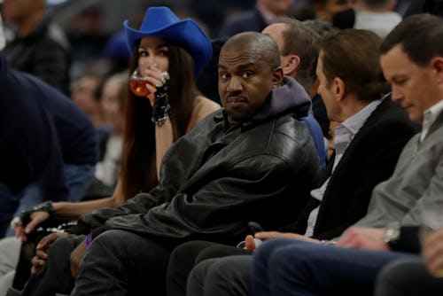 SAN FRANCISCO, CALIFORNIA - MARCH 16: Kanye West, left, talks with Golden State Warriors co-owner P...