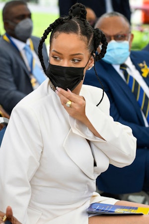 Rihanna Fenty gestures prior to speaking as she is named Barbado's 11th National Hero during the Nat...