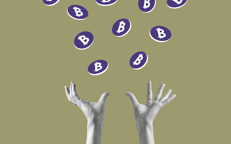 Hands catching Bitcoin coins that are falling