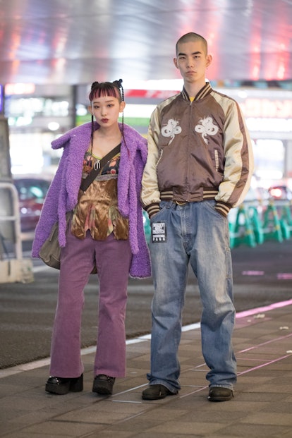 TOKYO, JAPAN - MARCH 15: 詩羽 utaha is seen wearing purple coat and pants outside Shibuya Hikarie duri...