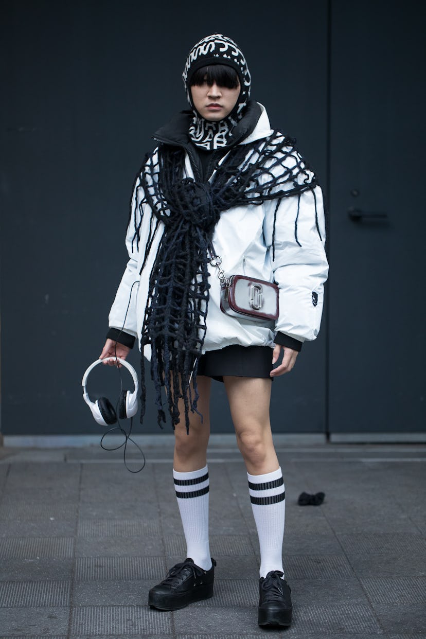 TOKYO, JAPAN - MARCH 18: A guest is seen wearing monochrome outfit with black and white print hoodie...