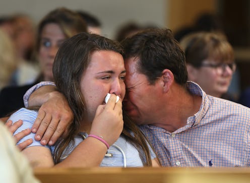 Conrad Roy, Jr., father of the Conrad Roy III, comforts his daughter Camdyn Roy, sister of the decea...