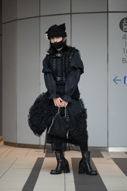 TOKYO, JAPAN - MARCH 15: A guest is seen wearing noir kei ninomiya outside Shibuya Hikarie during Ra...