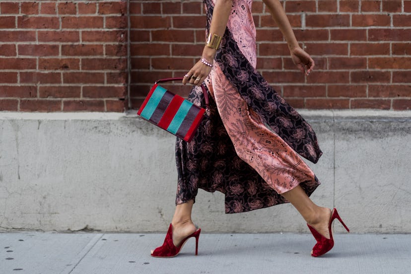 Aimee Song wearing a striped bag.