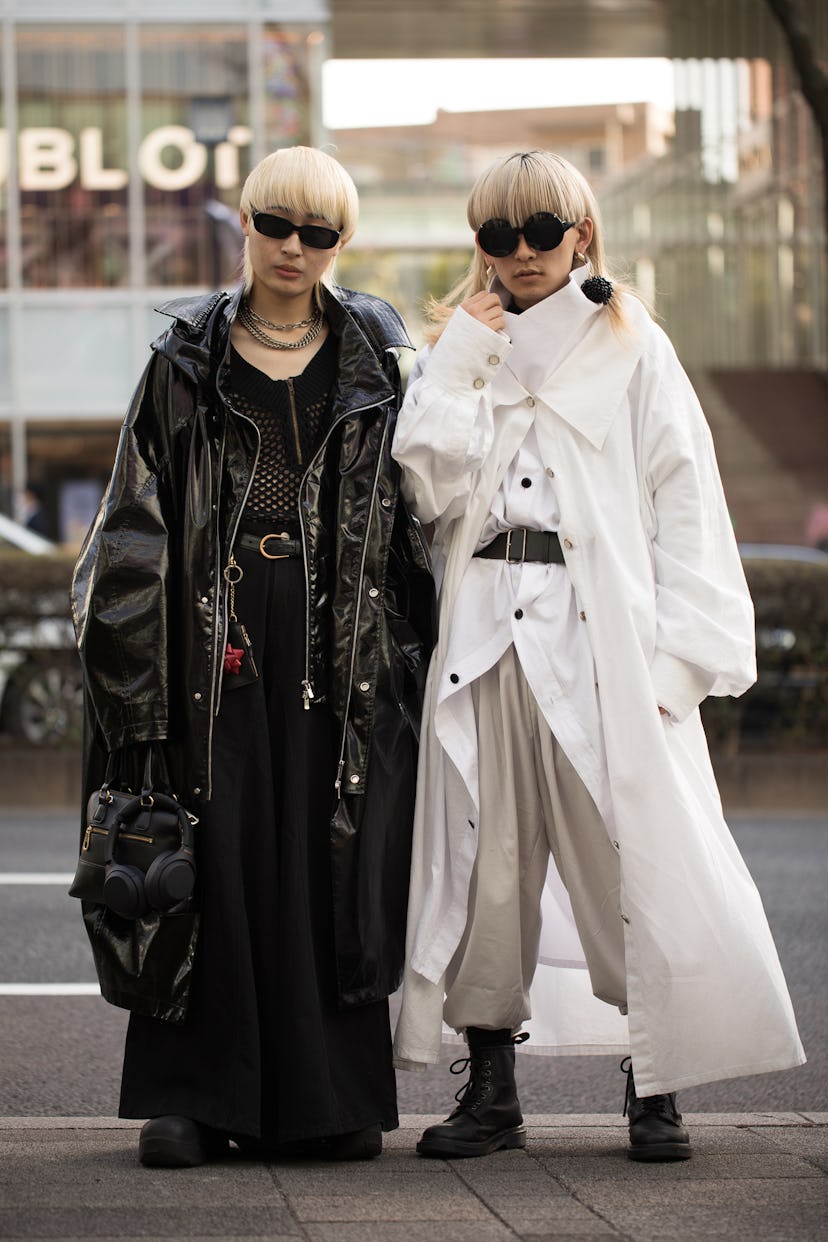 TOKYO, JAPAN - MARCH 16: Guests are seen wearing black and white monotone outfits with sunglasses ou...