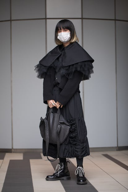 TOKYO, JAPAN - MARCH 17: A guest is seen wearing all black outfit with black bag and boots outside S...