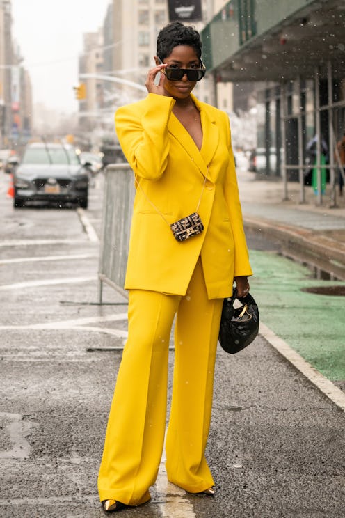 Jenner Naylor wears wears a marigold Zara suit.