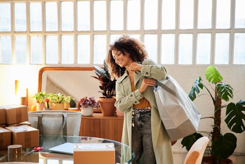 A woman schleps a large tote bag. Here's your daily horoscope for today, March 24, 2022.