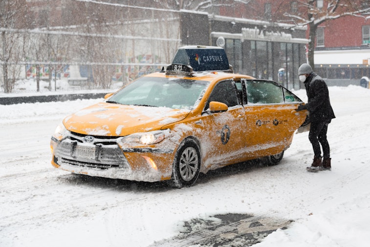 NEW YORK, NEW YORK - JANUARY 29: A person gets in a yellow cab on the Upper West Side on January 29,...