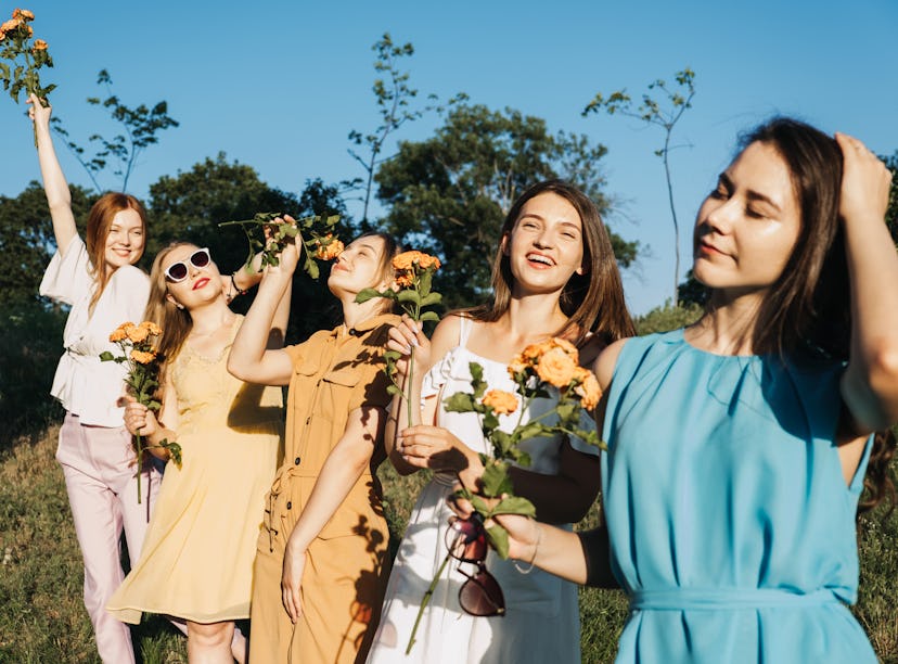 Friends in a flower field would need April captions and quotes for Instagram. 