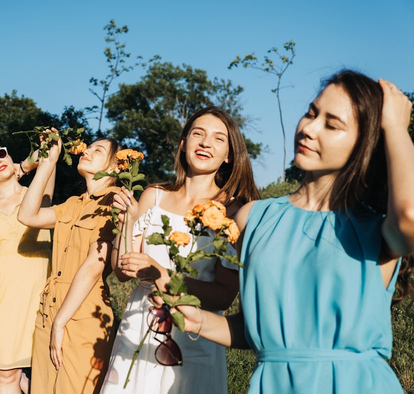 Friends in a flower field would need April captions and quotes for Instagram.