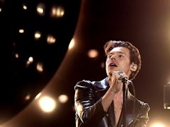 Harry Styles on stage during his 'Love On Tour.' Fans are sharing theories about his upcoming new al...