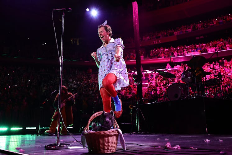 Harry Styles on stage dressed as Dorothy from the Wizard of Oz during his Love On Tour performance d...