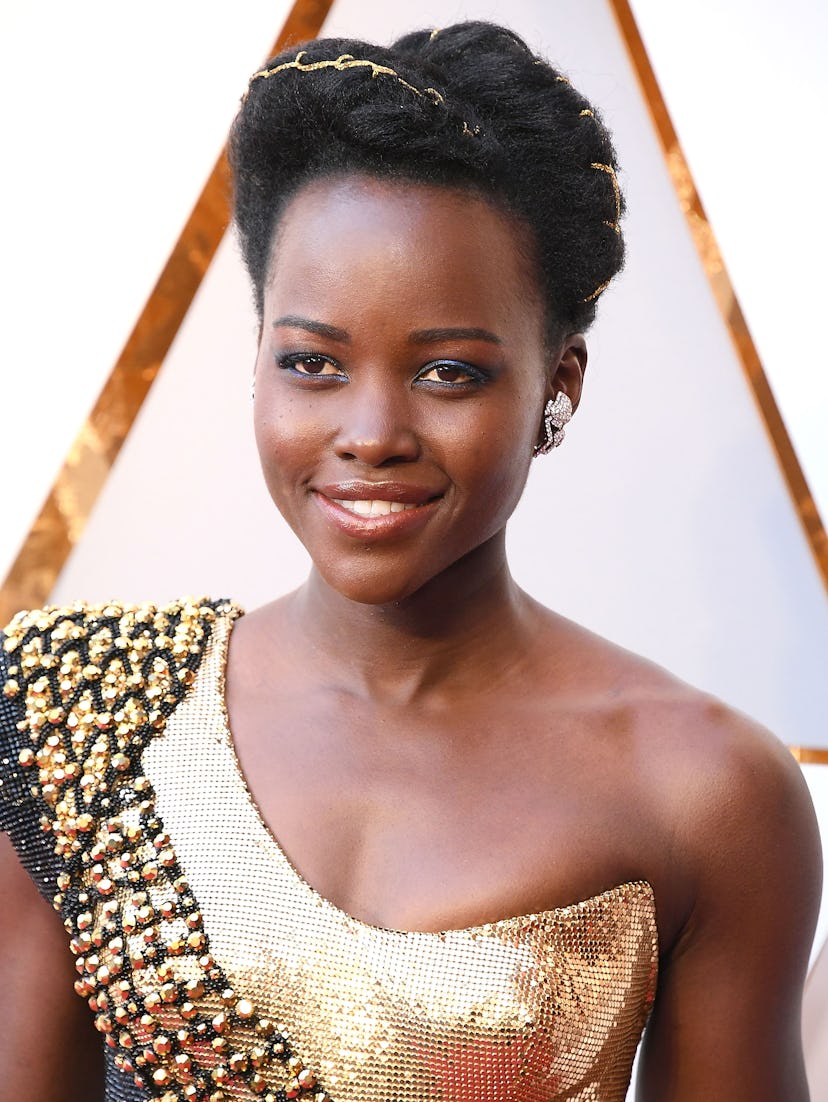 Lupita Nyong’o’s gold-accented updo at the Oscars.