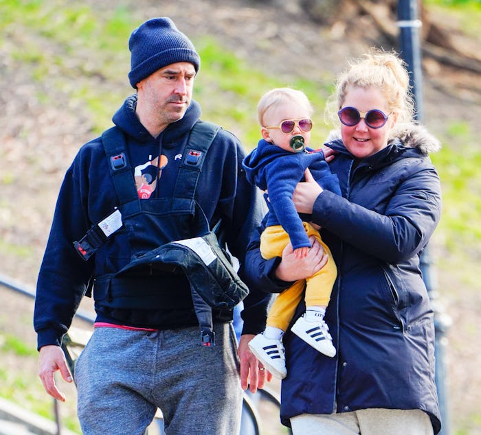 NEW YORK, NEW YORK - MARCH 22: Amy Schumer and Chris Fischer take baby Gene Fischer out for some mor...